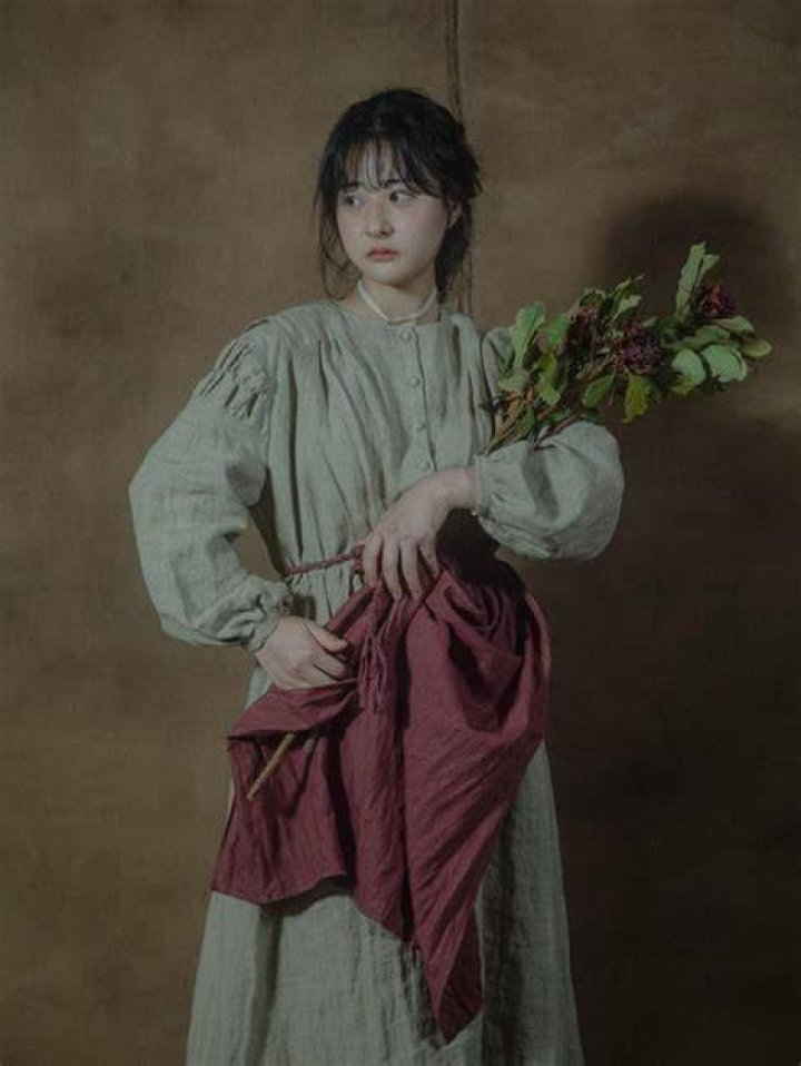 Dior a person holding a dress