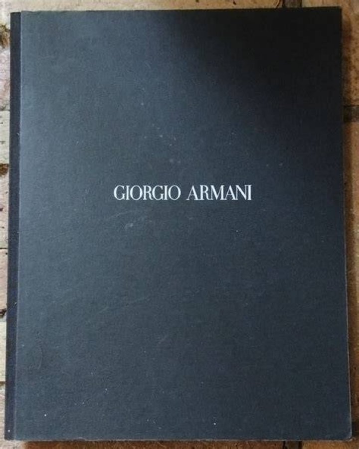 a vintage book about armani in a guide to sophia roe copenhagen style