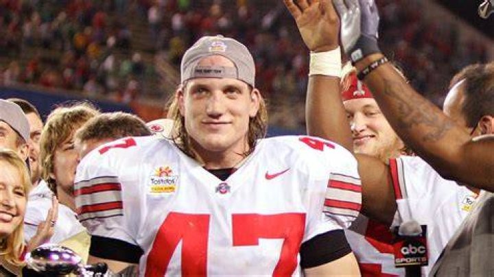 AJ Hawk posing with his wife Laura 