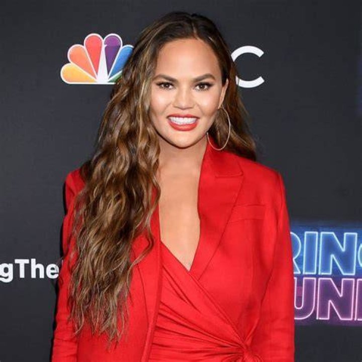 Chrissy Teigen Debuts Red Hot Hair Transformation