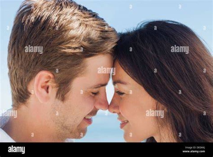 close up of young romantic couple is kissing and enjoying