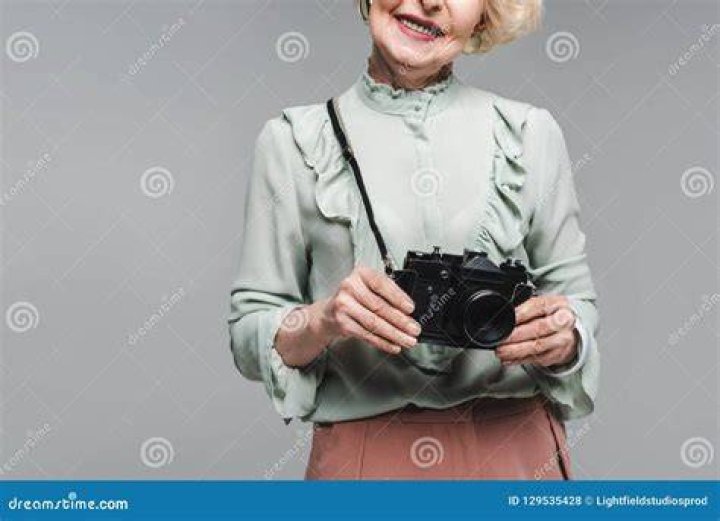 cropped shot of a senior man sitting alone in his kitchen and taking pills