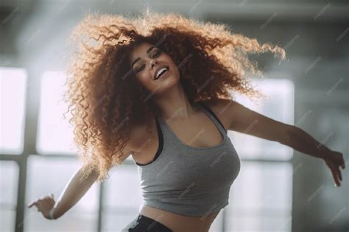 Curvy woman dancing in a grocery store