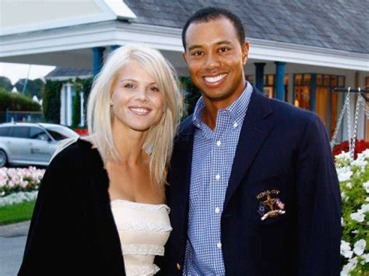 Elin Nordegren, right, and her daughter Sam Alexis Woods follow Tiger Woods and Charlie Woods on 18th hole. Photo / AP