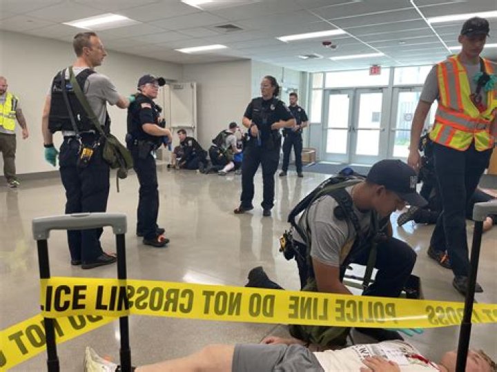 Emergency personnel conduct searches. Photo / AP