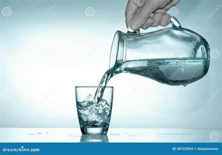 Filling glass of water