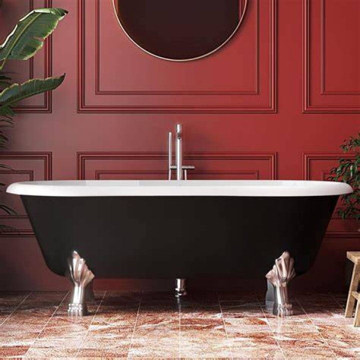 free standing clawfoot tub in large bathroom