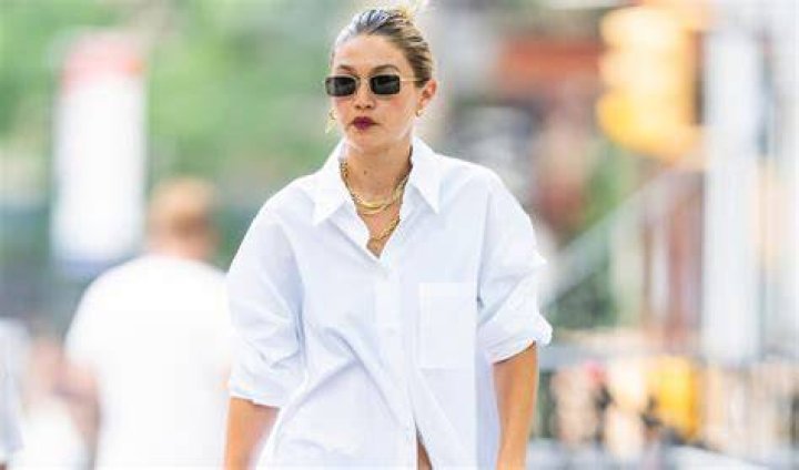 Gigi Hadid Is Cool in an Oversize White Shirt and Cashmere Pants