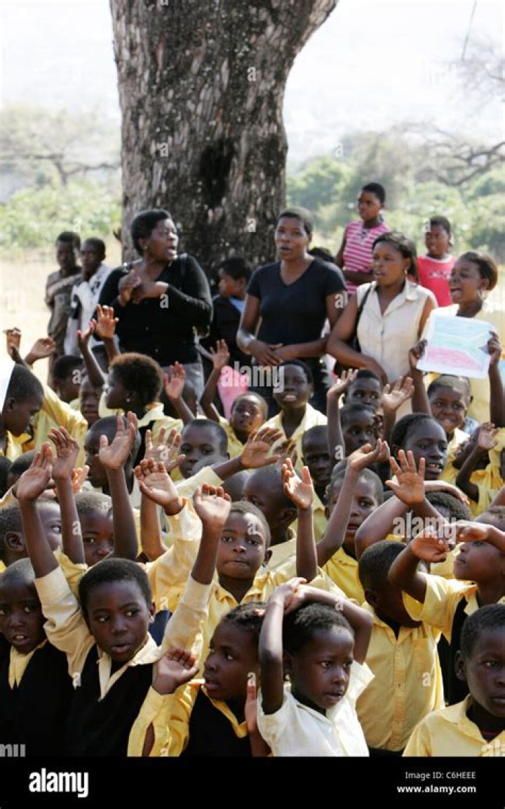 Group of children gathered outside in a circle