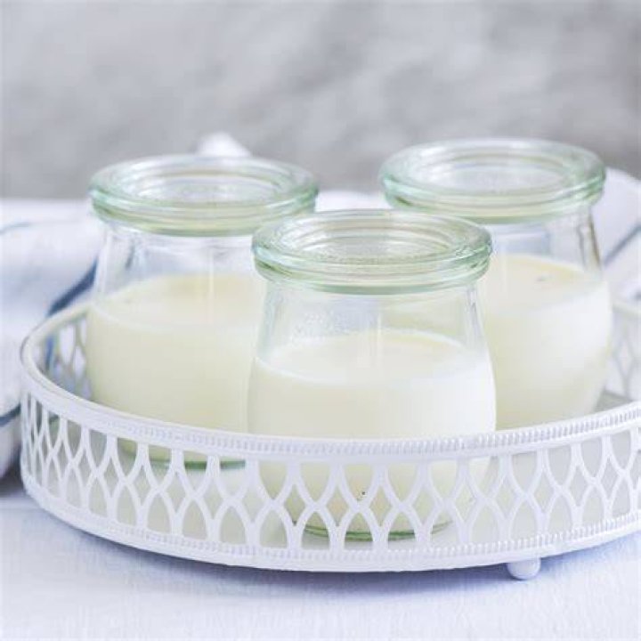 homemade yogurt in jars on rustic wooden table