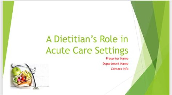 hospital dietitian consults with a male patient who's in bed
