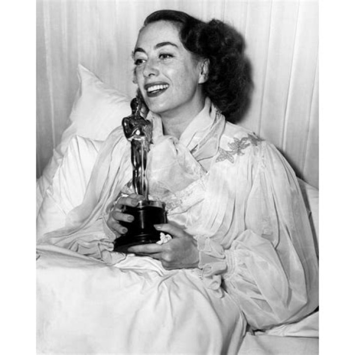 Joan Crawford receives her Oscar for 'Mildred Pierce' in bed in 1946