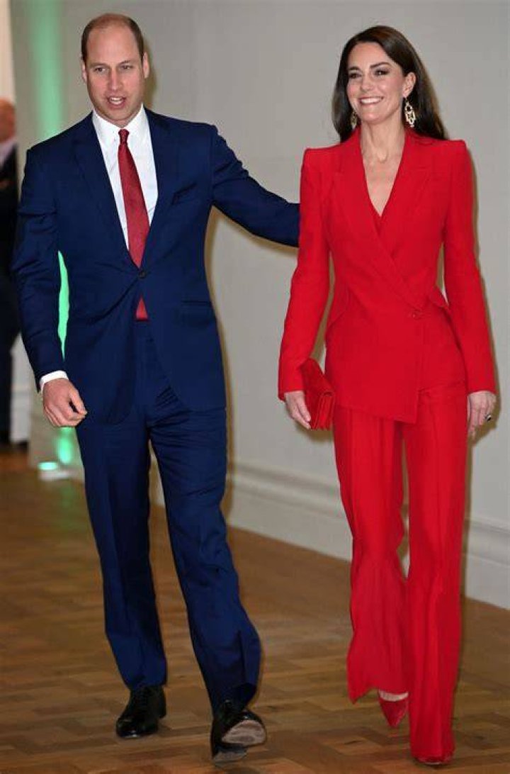 Kate brightens up her royal wardrobe with a red trouser suit
