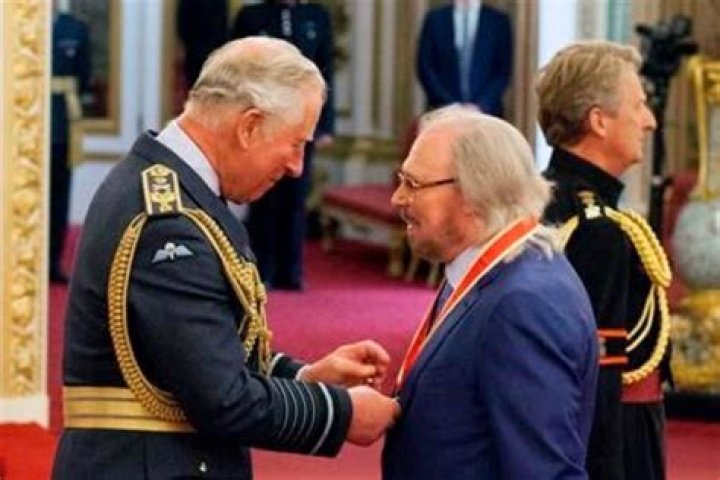 Knight fever Bee Gees star Sir Barry Gibb at palace