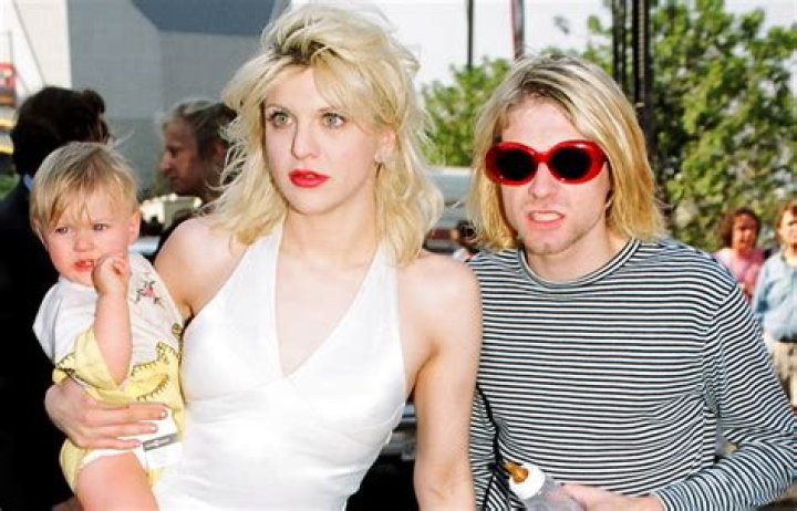 (L) Kurt Cobain, Courtney Love and their daughter Frances. (R) Tony Hawk, wife Erin Lee, son Spencer and his son Riley. Photo / Getty Images