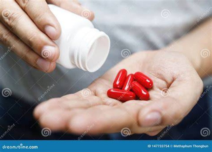 man hand holding medicine