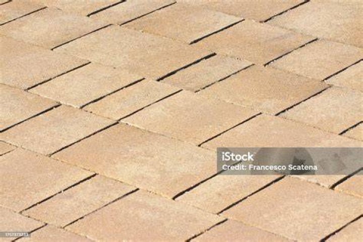 New paving made with italian travertine stone blocks of rectangular shape for pedestrian zone - "nseamless pattern image useful for renderings applications