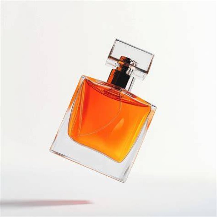 Perfume, Product, Orange, Liquid, Fluid, Cosmetics, Material property, Peach, Beige, 