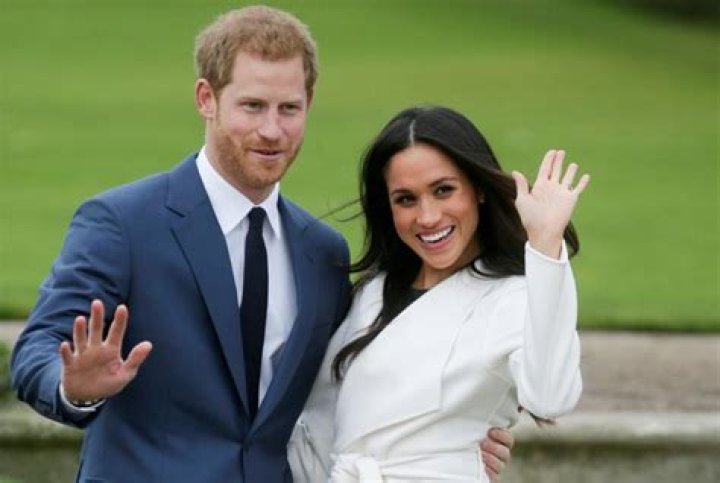 Prince Harry and Meghan Markle follow closely behind King Charles inside Buckingham Palace. Photo / Getty Images