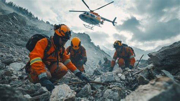Rescue workers working in the wreckage of a passenger plane that crashed into a gorge while attempting to land at a newly opened Nepal airport, killing at least 68 of the 72 people aboard. Photo / Yunish Gurung, AP