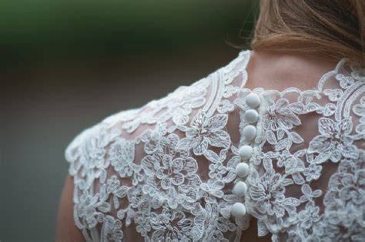 Shoulder, Dress, Textile, Bridal clothing, Joint, White, Wedding dress, Formal wear, Gown, Fashion model, 
