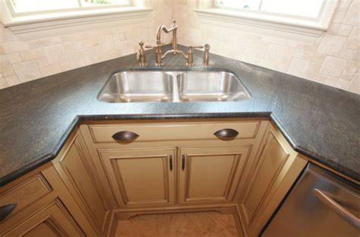 Sink and cabinets in corner of bathroom