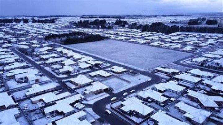 Snow on rooftops over Rolleston earlier this morning. Photo / Brent Conlan