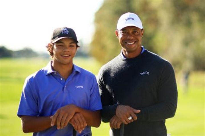 Tiger Woods and his son Charlie wait to putt on the 12th green during the final round of the PNC Championship golf tournament. Photo / AP