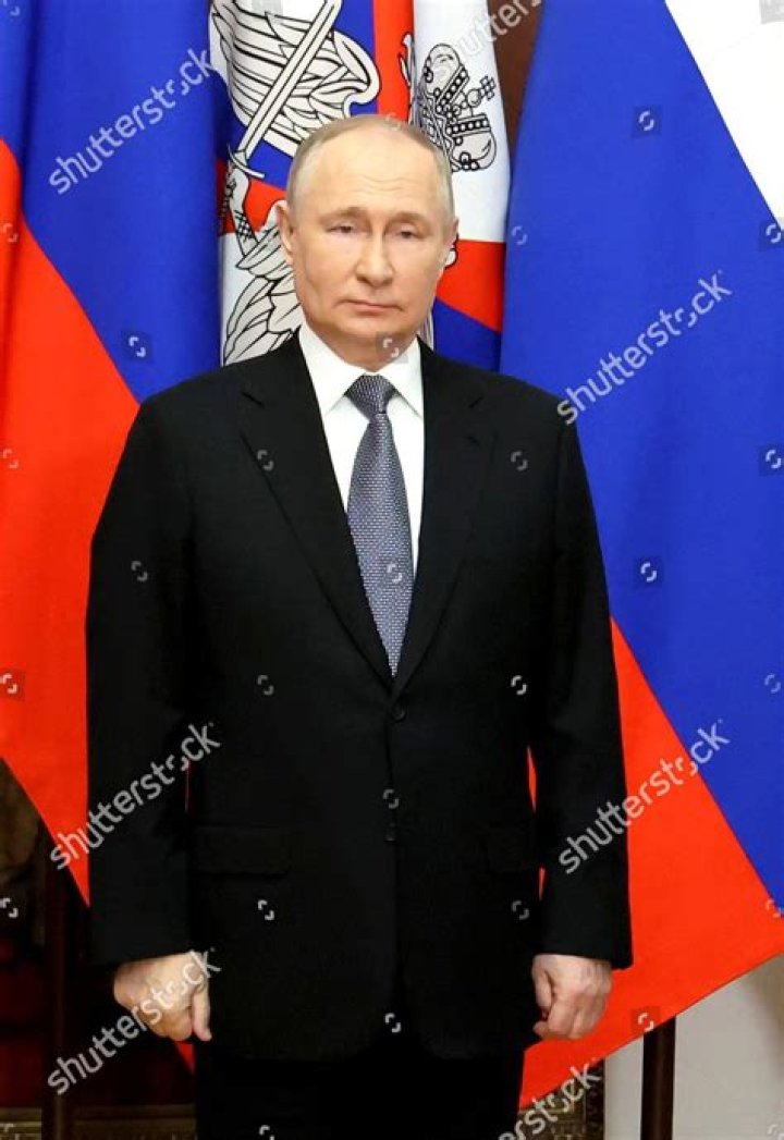 Vladimir Putin (right) poses for a photograph in this file photo with his parents Maria and Vladimir Spiridonovich Putin in 1985. Photo / Laski Diffusion, Newsmakers, Getty Images
