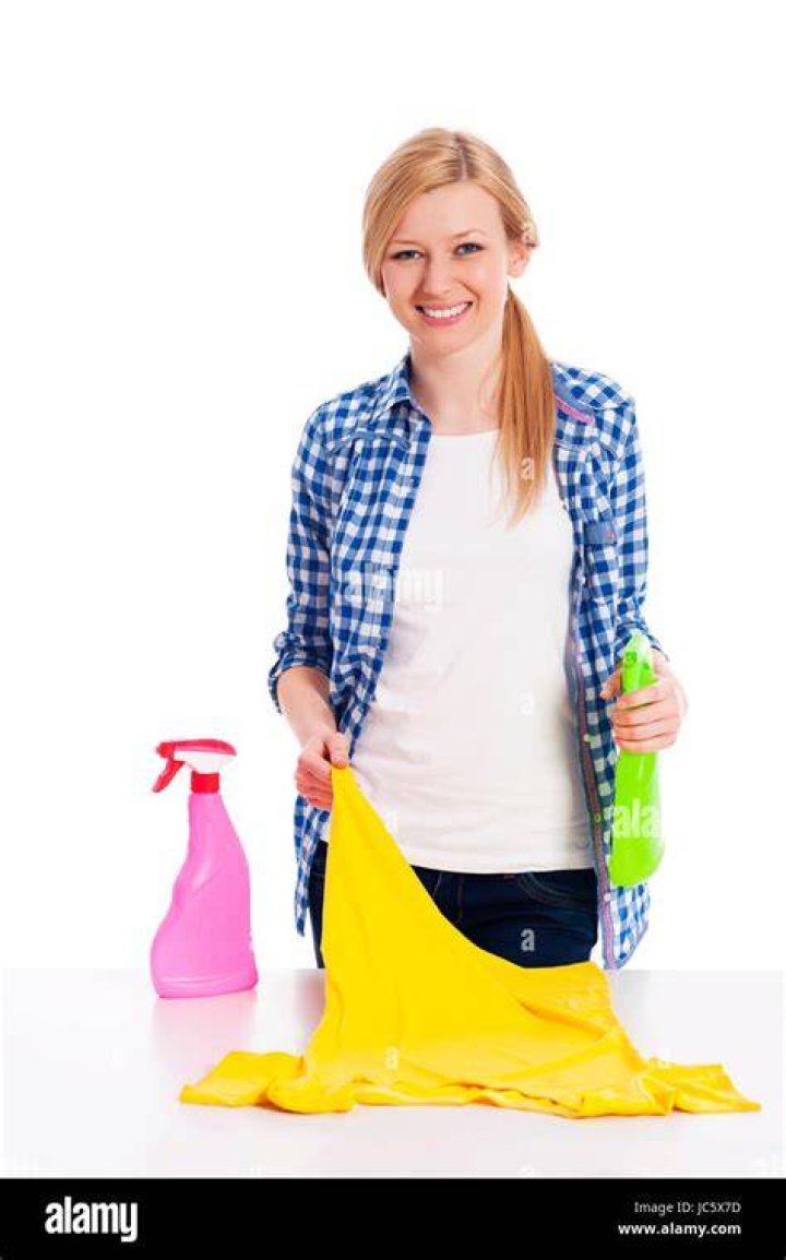 Woman Cleaning Stained Shirt in Bathroom Sink