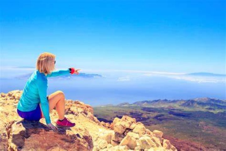 woman looking at an inspirational wall